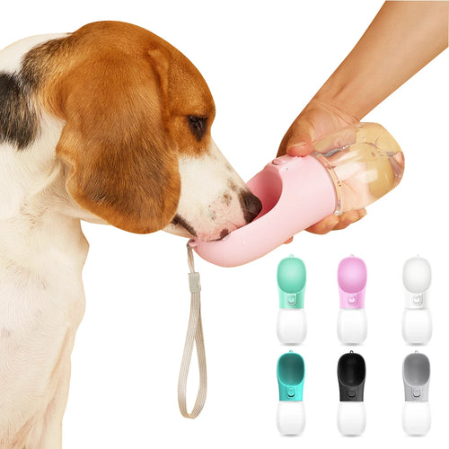 Pink portable pet water bottle with clear reservoir and attached strap, shown in use with dog drinking, multiple color options displayed.